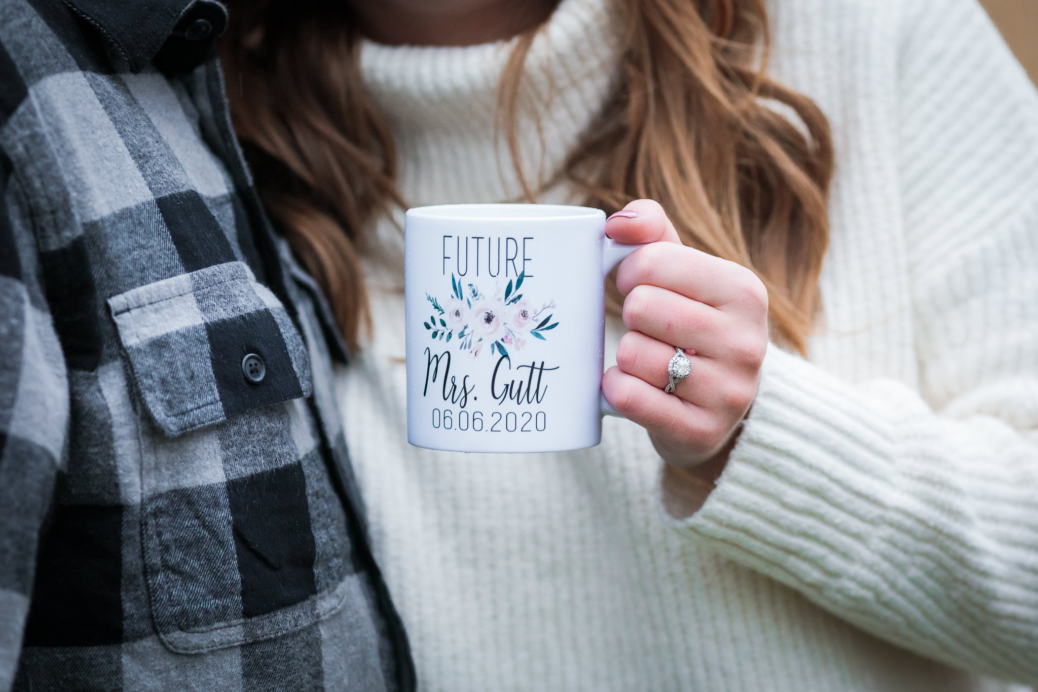 Bride-to-be holds a personalized mug during her North Shore engagement session in Pittsburgh, PA
