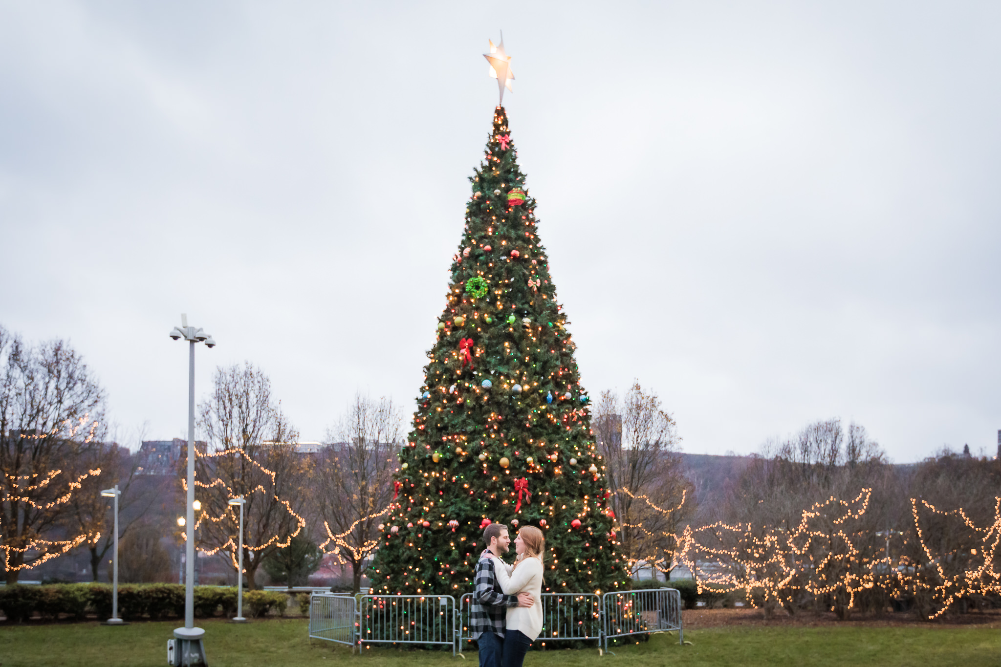 Couple in front of Heinz Field Christmas tree during a winter North Shore engagement session